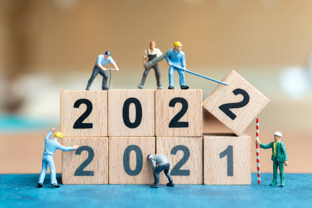 5 Holiday Gift Ideas You Can Give To Your Construction Team 3 - Lunacon Construction Group miniature people worker team create wooden block number 2022 happy new year concept 1920